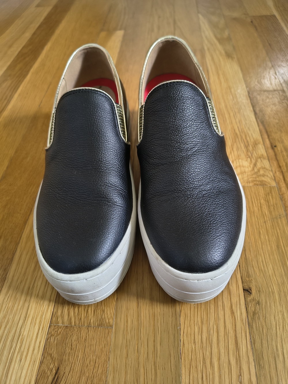 Skechers Slip-On Women's Sneakers in Black and White with Gold Trim